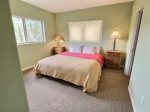 King bedroom with privacy shades, closet and ensuite bath